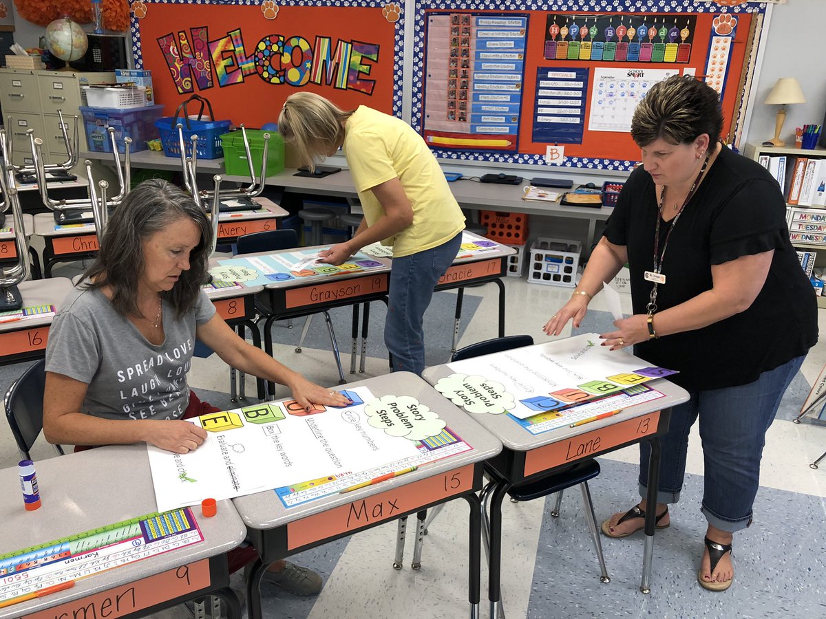 TraceyMills94's tweet photo. 2nd grade teachers using SIP day to make posters to facilitate learning and make a difference for our students so they can meet Math improvement goals. #TriC #Carterville5 #secondgrade https://t.co/8HLbAEyLkA