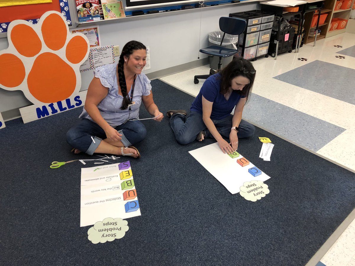 TraceyMills94's tweet photo. 2nd grade teachers using SIP day to make posters to facilitate learning and make a difference for our students so they can meet Math improvement goals. #TriC #Carterville5 #secondgrade https://t.co/8HLbAEyLkA