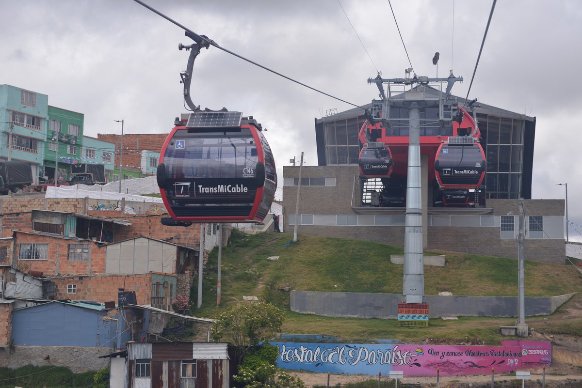 Transdev's tweet photo. @thierrymallet @GautierMignot2 @TransMilenio We also operate the @TransMiCableBOG, the 1st #UrbanCable car in Bogota, which has profoundly transformed the underprivileged districts of Ciudad Bolivar: ↘️ travel times from 1h30 to 15min, ↘️ unemployment, ↗️ investments in cultural infrastructure: #mobility makes life move! https://t.co/ilgqj8SHUh