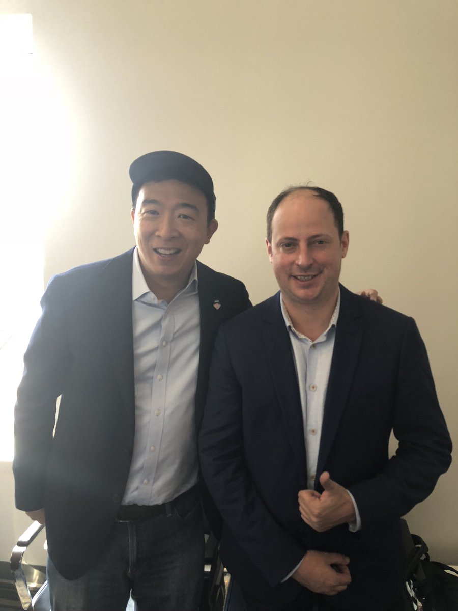 AndrewYang's tweet photo. Ran into @NateSilver538 and @galendruke at the airport and a podcast broke out.  @FiveThirtyEight https://t.co/HVJEdBejml