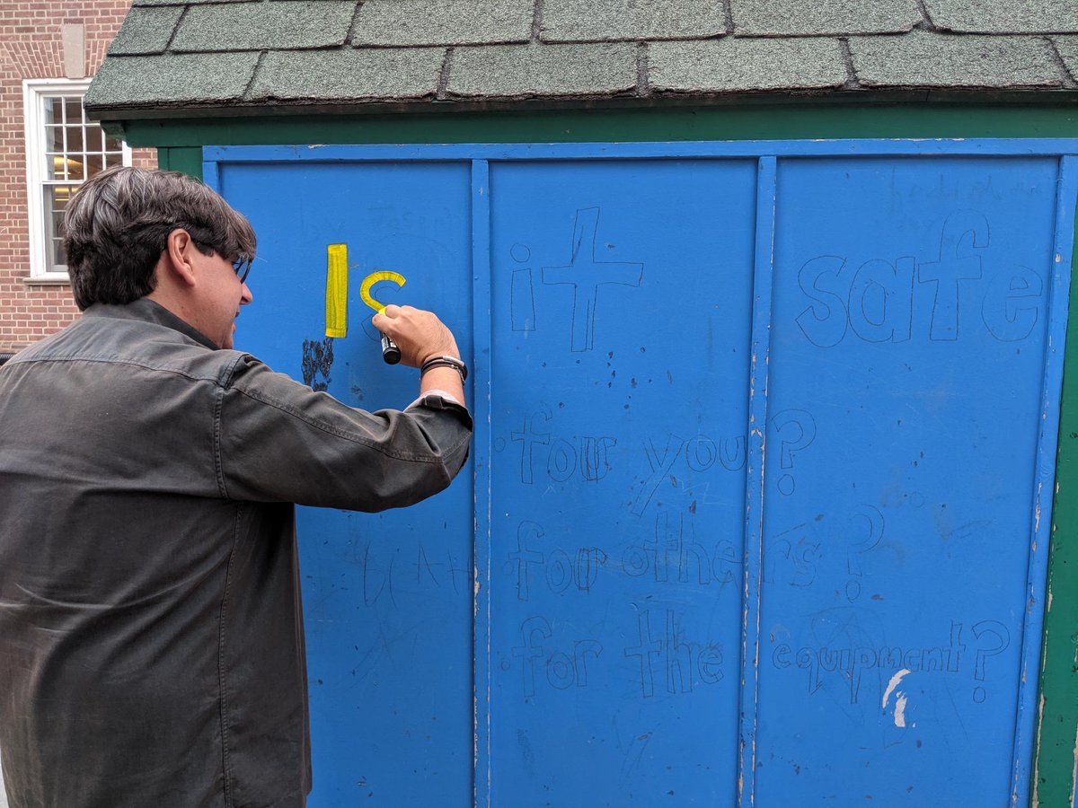jicslabschool's tweet photo. Richard is writing on the storage shed the questions we need to ask when we make choices during recess: Is it safe? Is it kind? Is it inclusive? Recess is an important part of the learning day. #SelfDirectedPlay @EarthDayCanada https://t.co/6jRIFrkLaj