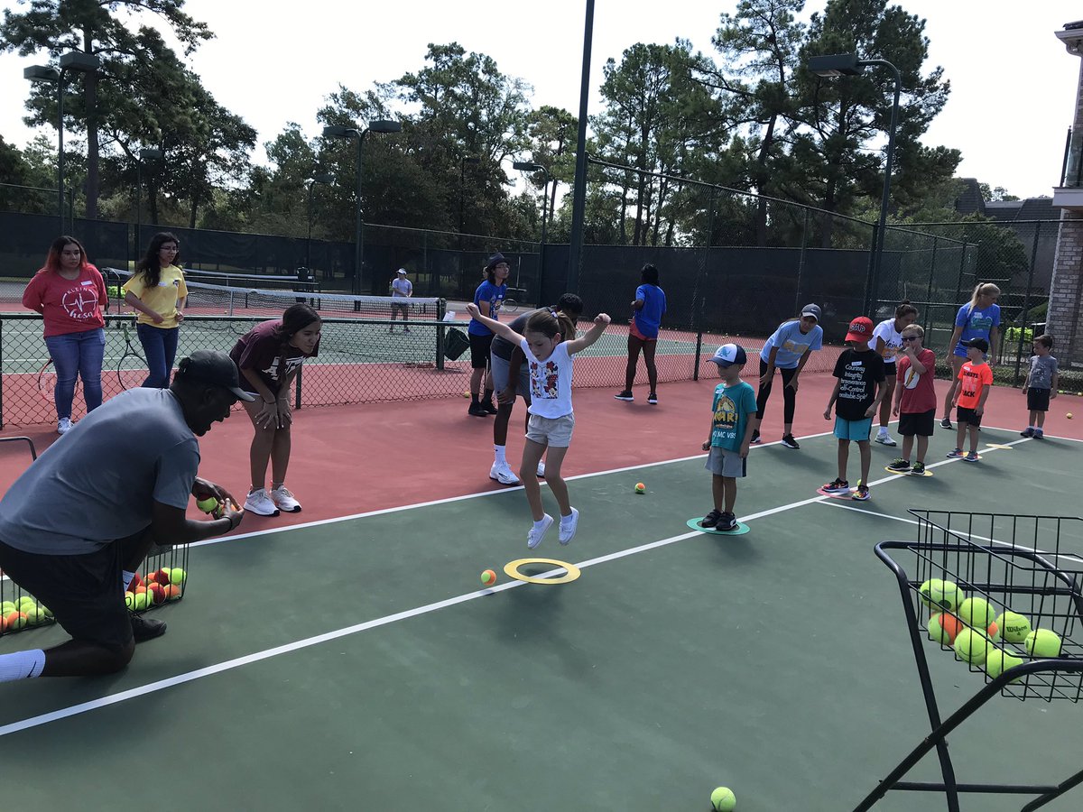 “Fun in the Sun” B.E.S.T. members volunteer at the LoveAll tennis clinic.