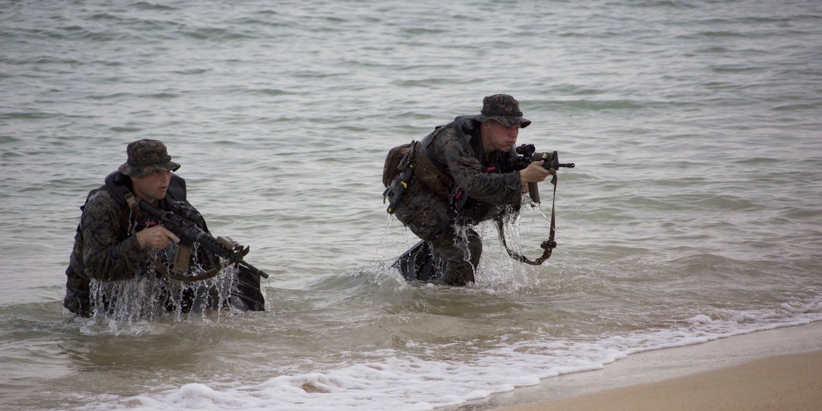 Scout swimmers with the <a href="/31stMeu/">31stMEU</a> survey and secure a beach during an amphibious raid by Combat Rubber Raiding Craft in conjunction with the insertion of a High Mobility Artillery Rocket System by landing craft from the <a href="/USNavy/">U.S. Navy</a> dock landing ship USS Ashland.