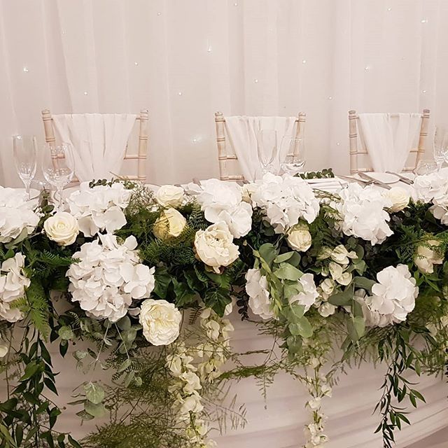 Amazing top table - one of the most realistic silk creations we've done to date! #downhallweddings #downhall <a href="/down_hall/">Steven hall</a> #silkflowergarland #silkflowersrock #whitewedding #toptable #floraltoptable #toptableflowers #silkflowerhire #toptablestyling #weddingdecor #weddinghire #w…