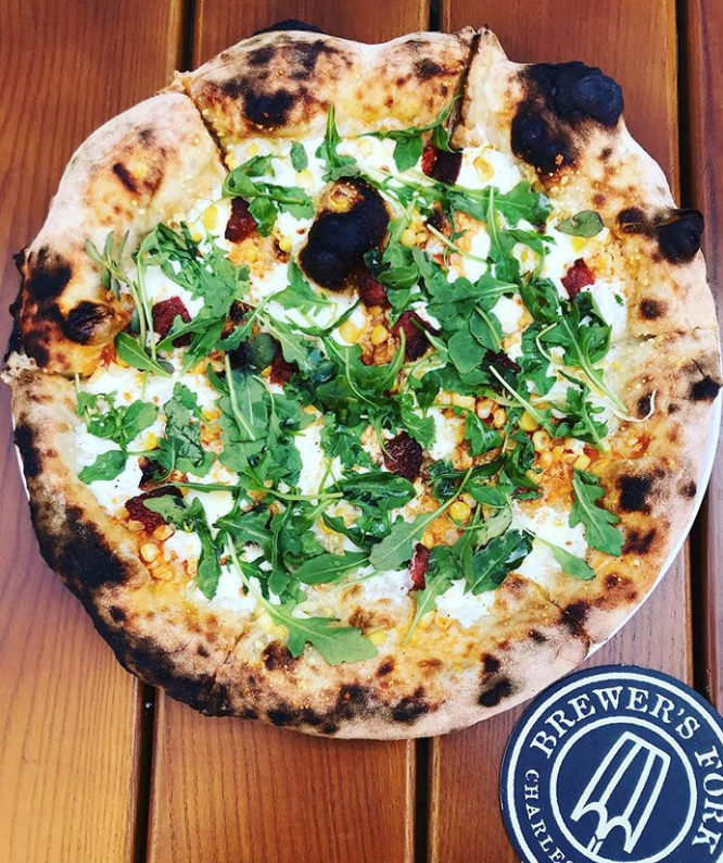 LovinFoodRescue's tweet photo. Chef John Payne of @BrewersFork makes wood fired pizzas that are pretty legendary (just look at that crust)! We're thrilled to have him cooking once again at #LovinTailgate on 11/3. Get your tickets at: https://t.co/hM7EZrhW5I https://t.co/8P6iaUizoA