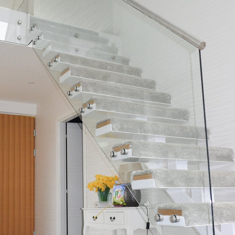 A glass staircase will complement modern interior design and allow more natural light into a hallway. 

If you have a similar project you would like us to work on, then please contact us through our website - zcu.io/wrki