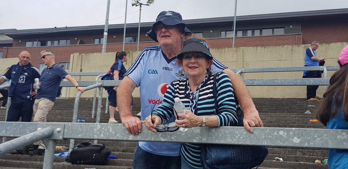 Fearghaloc's tweet photo. My Mam and Dad following the Dubs in Portlaoise last Summer. We are missing Mam so much today one year after she passed away. What a terrible day that was. But the happy memories are the ones we have now. We know she will be with us all in Croke Park today and with us all forever https://t.co/L9EJURTpeL