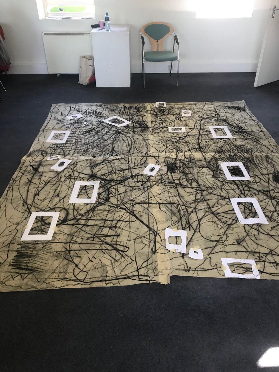 gastaut's tweet photo. Artist Sharon Kelly brandishing bamboo sticks tipped with charcoal as drawing implements for a group floor drawing #weaponsOfMassConstruction at the Drawing Out Seminar @ Damer House Gallery, Roscrea. @phurl https://t.co/cVMQp8GvCo