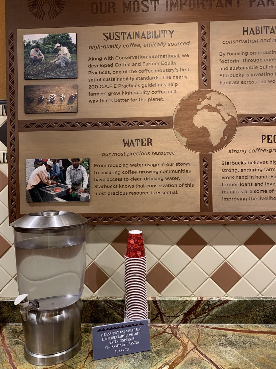 KjParton's tweet photo. Snapped this ironic scene in Starbucks yesterday. The backdrop shows a billboard discussing sustainability and conservation. The little sign in the foreground by the non-recyclable cups says “Please only use our single-use complimentary cups” - Come on... 🤷🏼‍♂️#SayNoToSingleUse https://t.co/04eD0hz8WE
