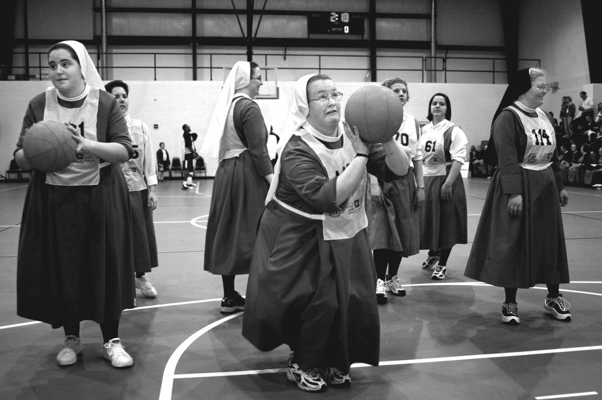 mohistorymuseum's tweet photo. Sister M. Isidoris of the Sisters of St. Francis of the Martyr St. George takes some practice shots before a 2002 fundraiser game between the sisters and the Harlem Ambassadors, a traveling team in this photo by @stltoday's David Carson. #InFocusSTL https://t.co/lTSfFYZFZT