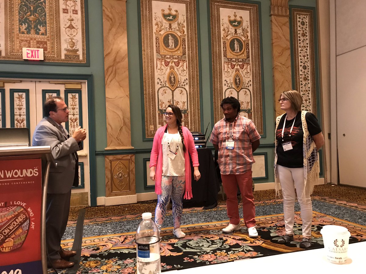 JWCeditor's tweet photo. Mitch Sanders demonstrating biofilm and quorum sensing with the audience. #wildonwounds #woundcare #tissueviabilty @Leannejane1975 @karenousey https://t.co/2NAKuJqM33