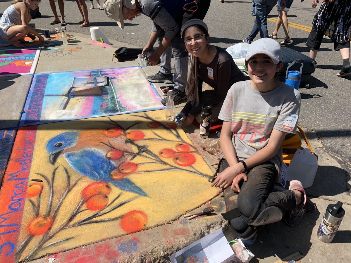 Jessenm32's tweet photo. A couple of former mustangs and current lobos putting their artistic skills on display today in downtown Loveland. #psdproud #pastelson5th @RMHSLOBOS https://t.co/PkYOZQPvcT