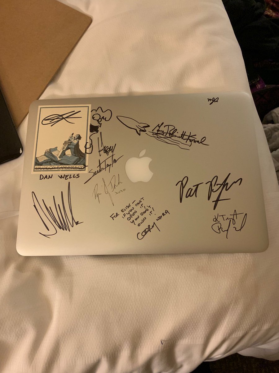 EMMcWriter's tweet photo. It’s the laptop I started writing on, signed by this crew of amazing artists. Inspiration from those who have gone before me. 
And other feelings. 
@BrandSanderson @PatrickRothfuss #coreydoctorow #piperjdrake #matthewdrake #howardtayler @MaryRobinette #ktempestbradford #wxr2019 https://t.co/DBEej221BG
