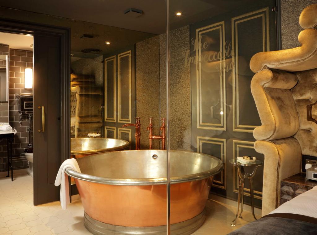 Anyone done The Whole Hog yet? Roll around in your 7-foot bed. Soak in your freestanding bath or walk-in drench shower. There's a four-seater hot tub and an outside sauna. Swine &amp; dine with a special BBQ package. All situated underneath a beautiful festooned canopy of lights.