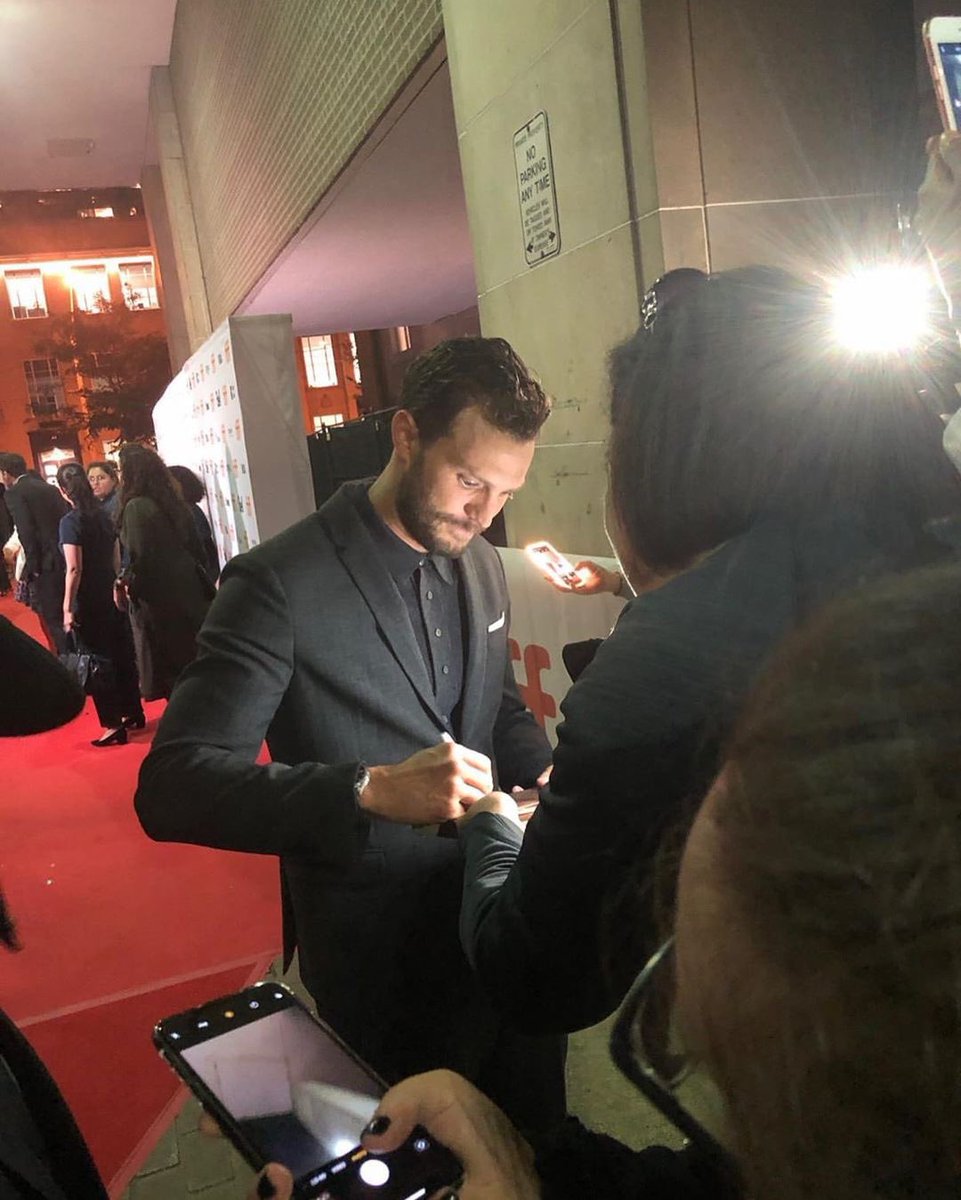 That moment that #JamieDornan sees the canvas I had made of our pic together from last year’s #TIFF .  He was so sweet to personalize it when he signed it.  Thanks to ladies around me in the fan zone for sharing your pics &amp; videos 😝 
📸: Jenn Kuhn
#TIFF19 #Toronto