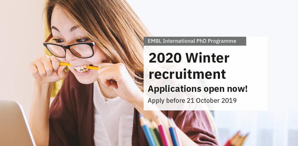 Text: EMBL International PhD Programme, 2020 Winter recruitment, Applications open now! Apply before 21 October 2019. Photo: Student studying in from of her computer, nervously biting her pencil.