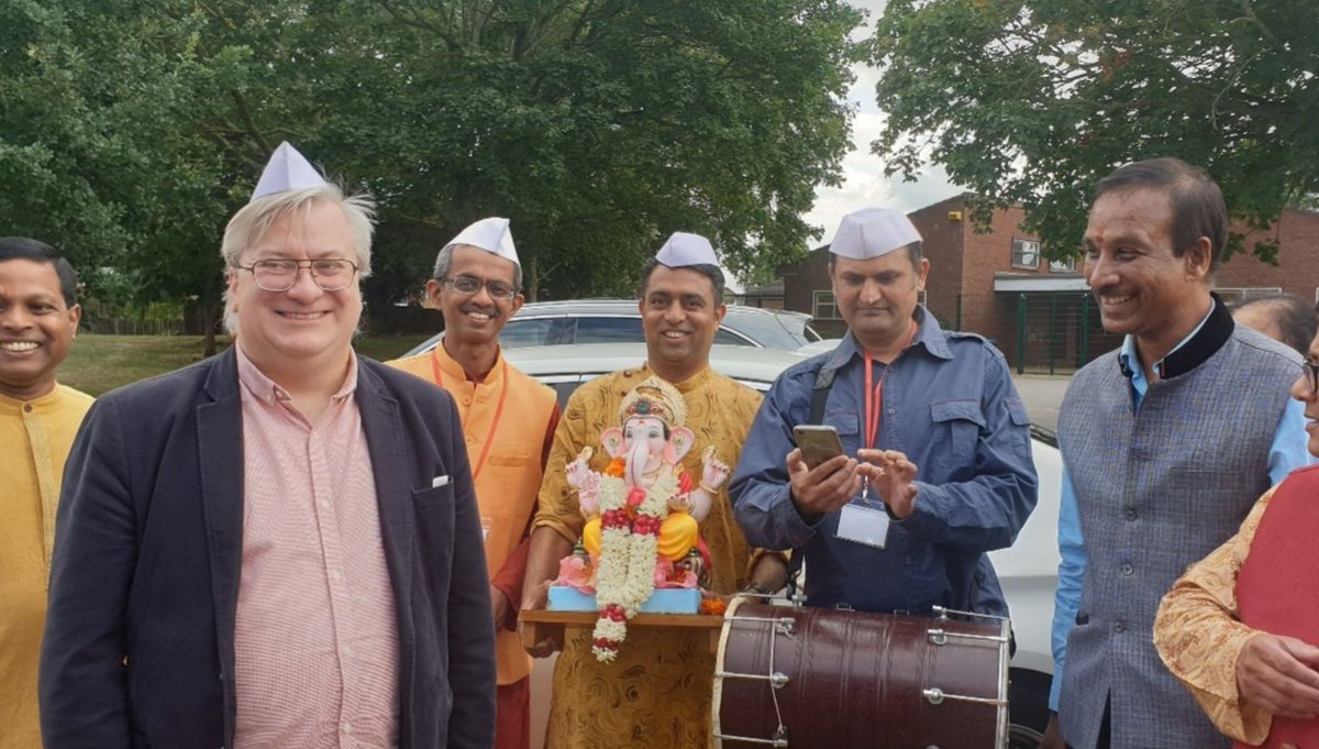 AyValeBlue's tweet photo. Cllr Mark Winn is a man who wears many hats. Here he his in his role of Cabinet Member for Communities at the #GaneshChaturthi festival with friends from Aylesbury Hindu Temple Trust. https://t.co/rx16mmv84K