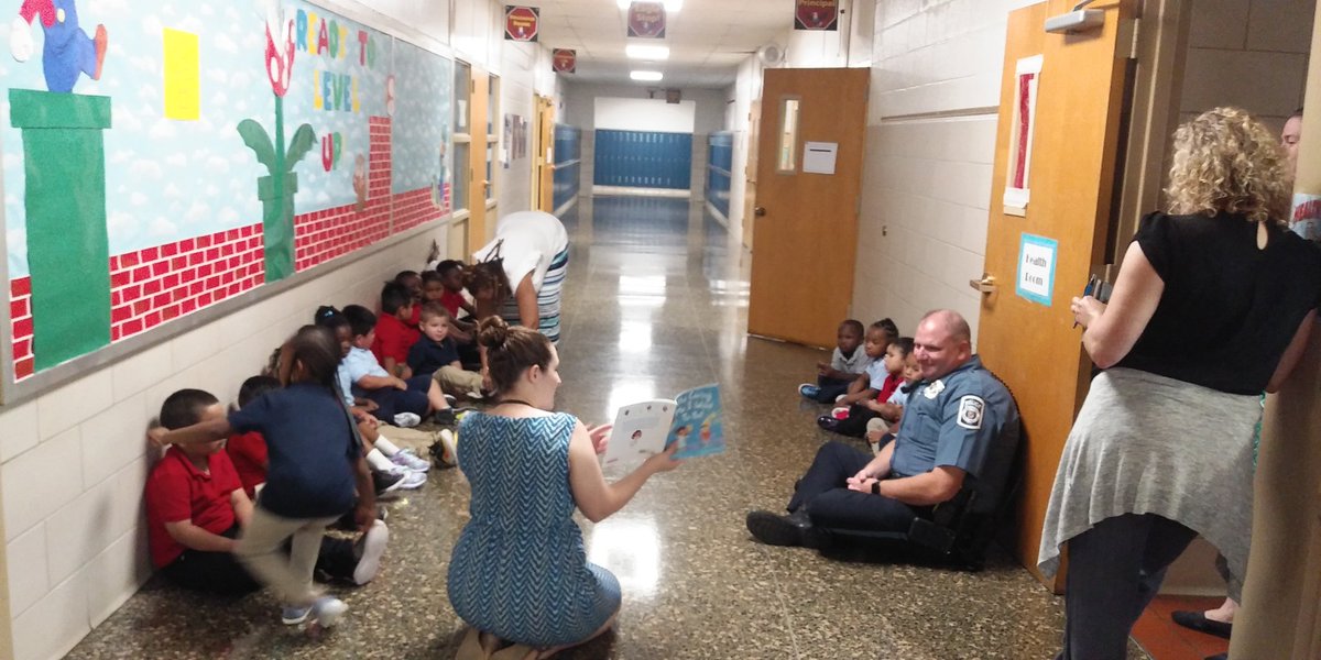 Our PreK listening to a story while waiting for vision and hearing testing with local law enforcement.  
#wearebettertogether #aacpsawesome #mces #mdcityeaglessoar
