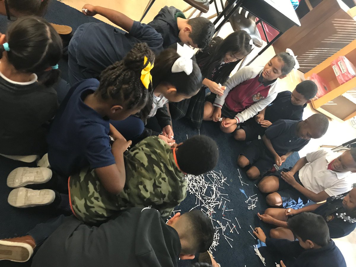 Second graders are working together to bundle tens and build understanding of place value.