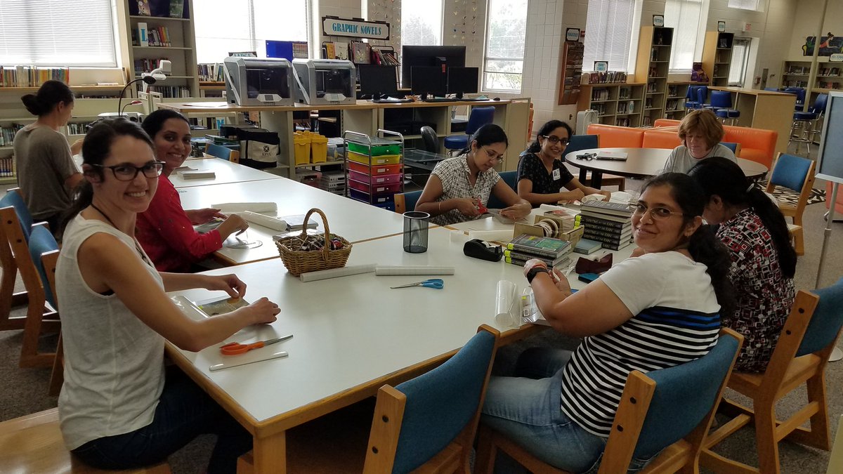 Iowa46's tweet photo. Look at these amazing parent volunteers that are covering books for us here at Scullen. We appreciate their gift of personal time and we are so excited to use these new titles! @ScullenSharks #scullenpride #futureready204 https://t.co/J6j8NyAoXJ