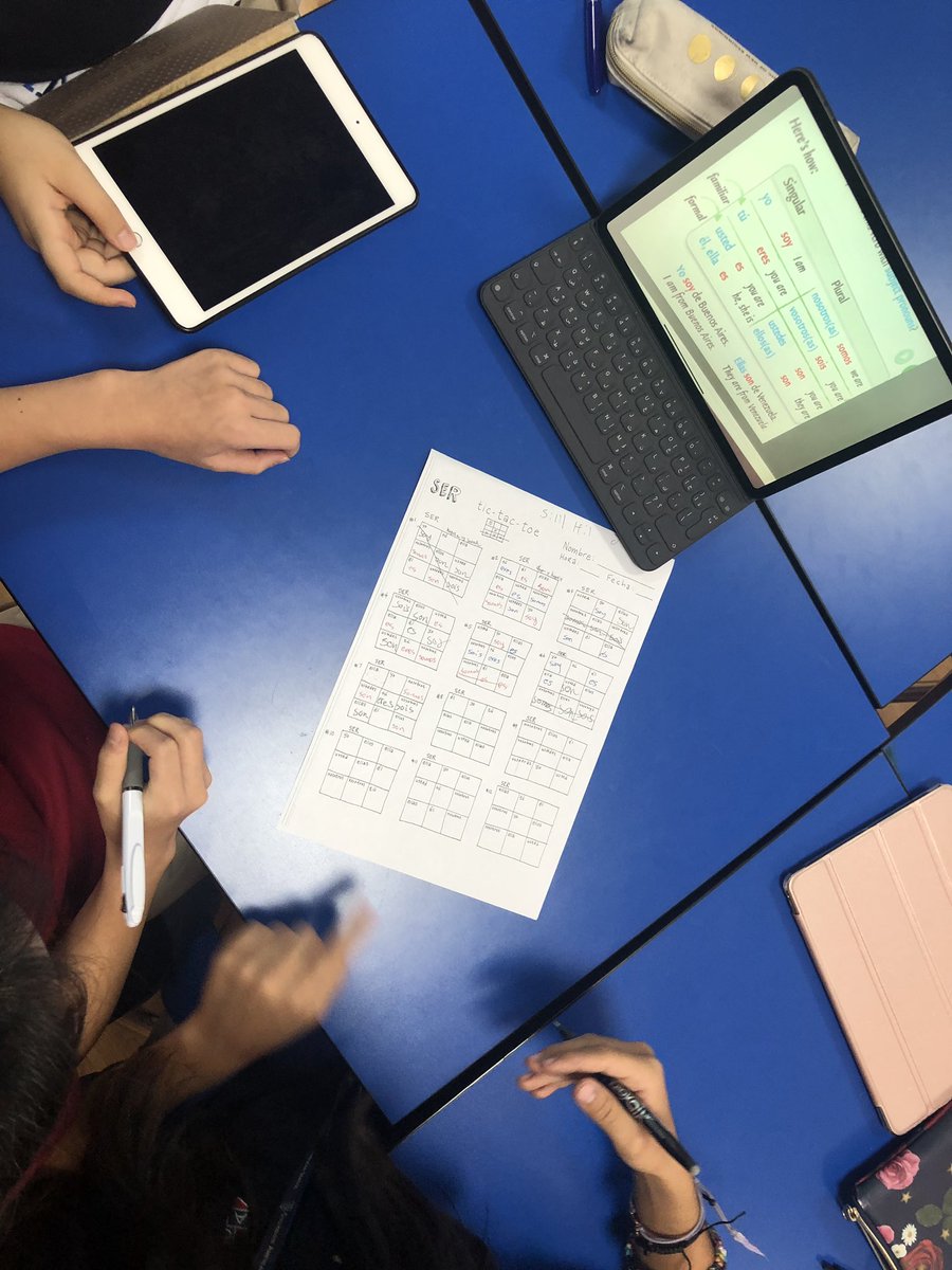 Grade 6 students learning Spanish verbs through games! Who is the best at Tic-Tac-Toe?