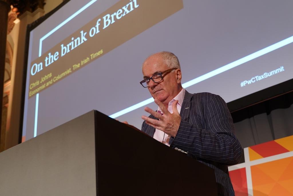 IrishTimesSales's tweet photo. Taking the stage now at #PwCTaxSummit is @IrishTimes Economist and Columnist, Chris Johns as he discusses being on the brink of #Brexit @PwCIreland https://t.co/He0k0KNYVM