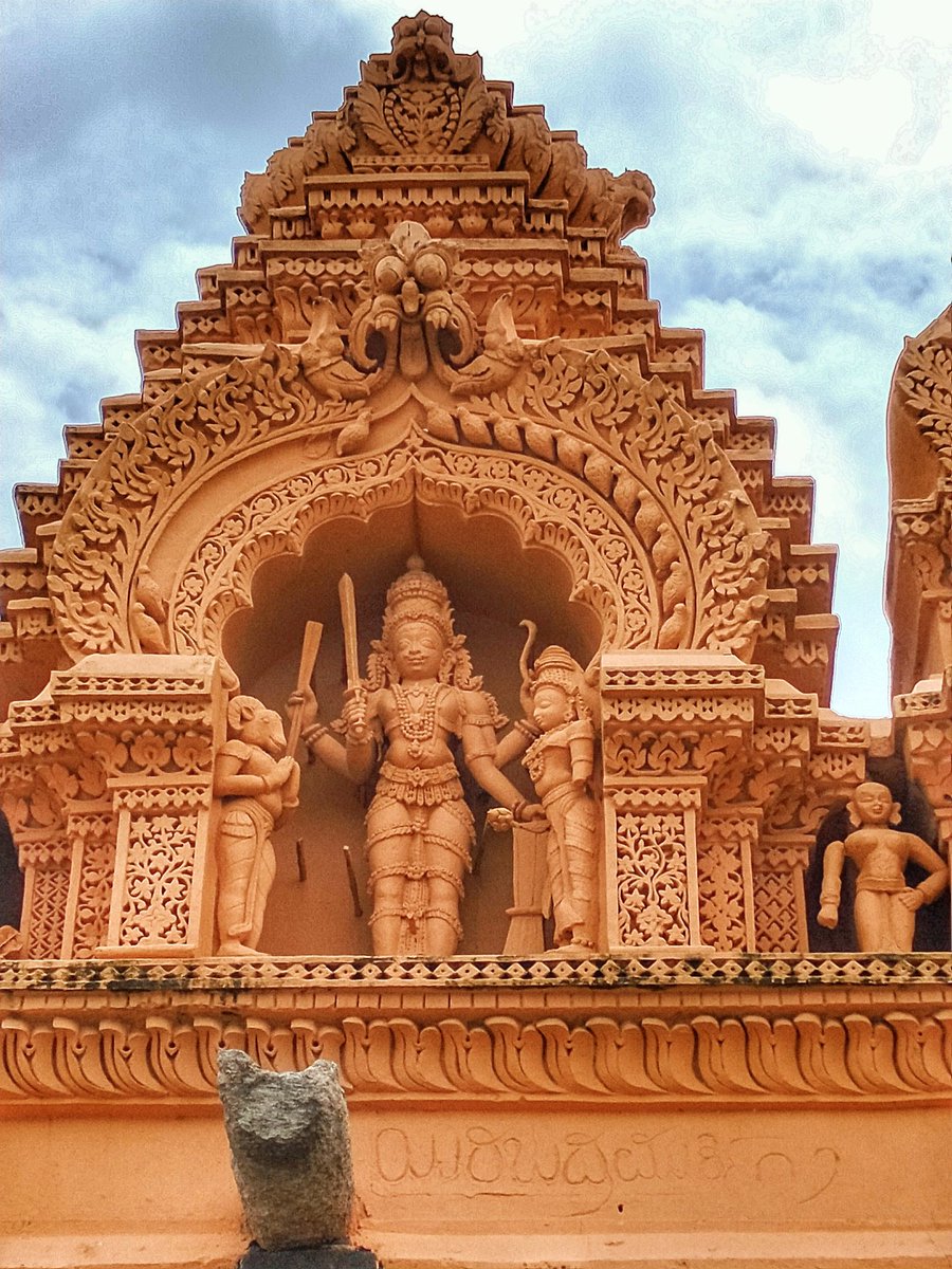 71) Veerabhadra Swamy. To his left is Bhadra Kali & to the right with the goat head is Daksha Prajapati with folded arms.