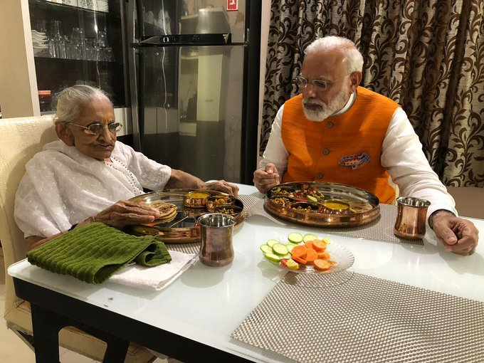 PeoplesGovIN's tweet photo. Prime Minister Narendra Modi meets his mother Heeraben Modi at her residence, in Gandhinagar. Today is PM Modi's 69th birthday. #HappyBirthdayPMModi https://t.co/rZwr8cXyC2