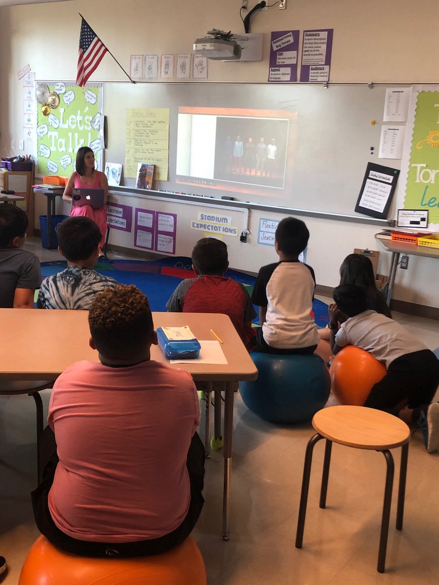 Our Library Goddess reading us “Sing a Song” by Kelly Starling Lyons