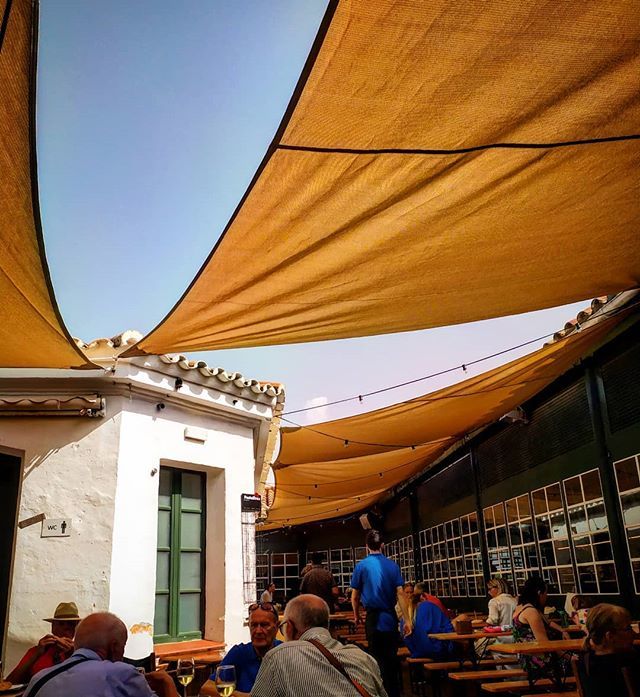 Love it. #sittingquietly #mercadodepescados #atmosphere #restaurant #tapas #summerinseptember #mahon #isla #relax #quiet #perfect #cheers #shadows #blue