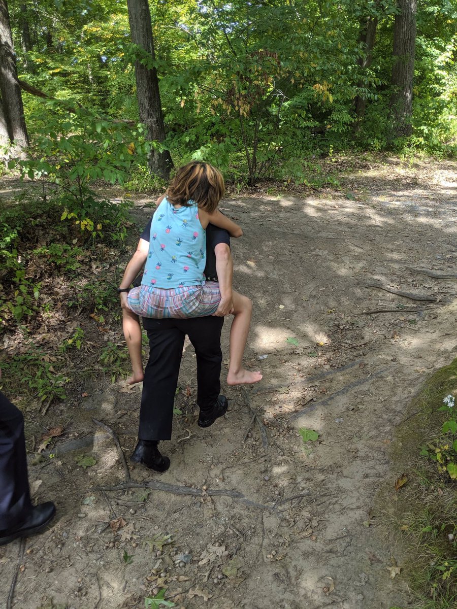 mht_nh_police's tweet image. This 10 yr old girl was reported missing on Sunday. After searching on West Side of Manchester for close to two hours, officers found her by the river. Officer Candice Thomas gave her a piggy back ride out of the woods and she was reunited with her mother.  A happy ending.