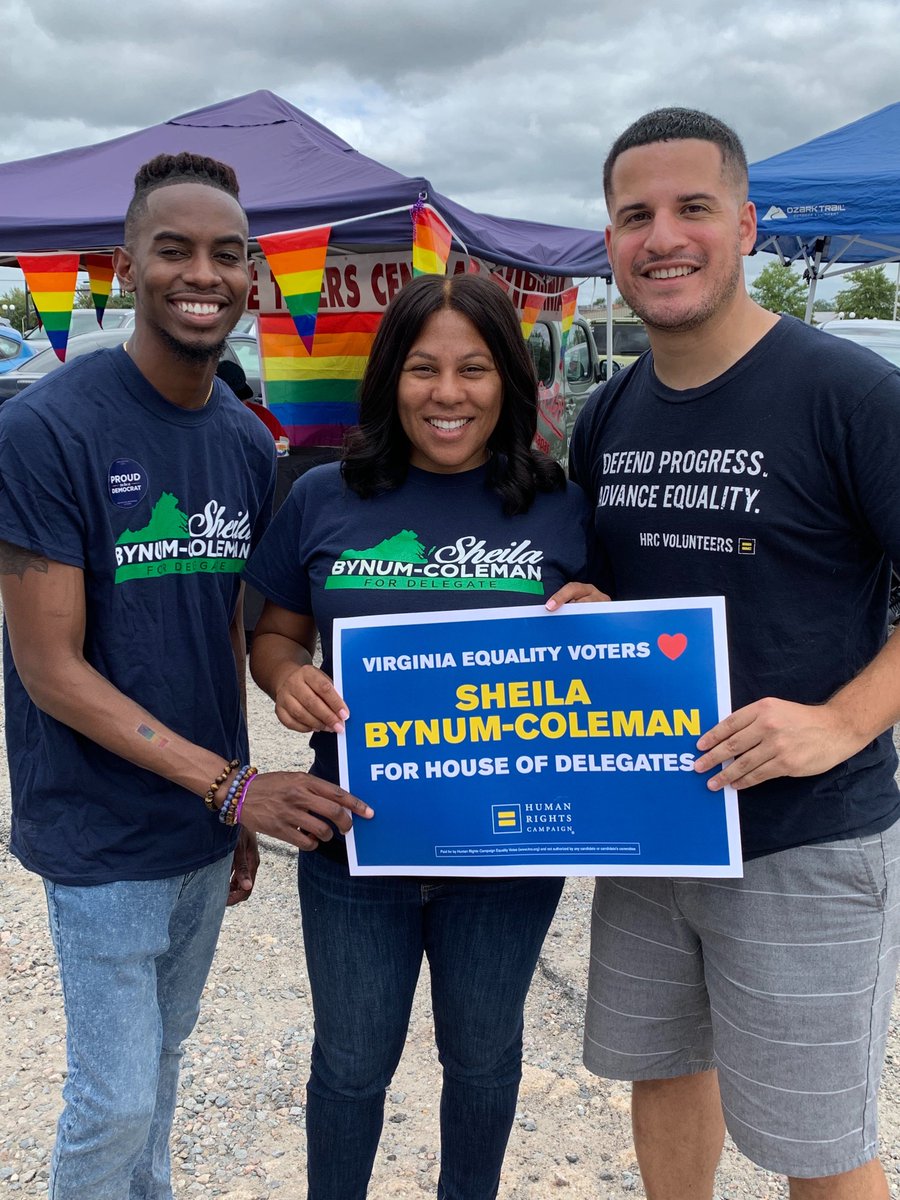 HRC volunteers and Sheila Bynum-Coleman holding up HRC sign