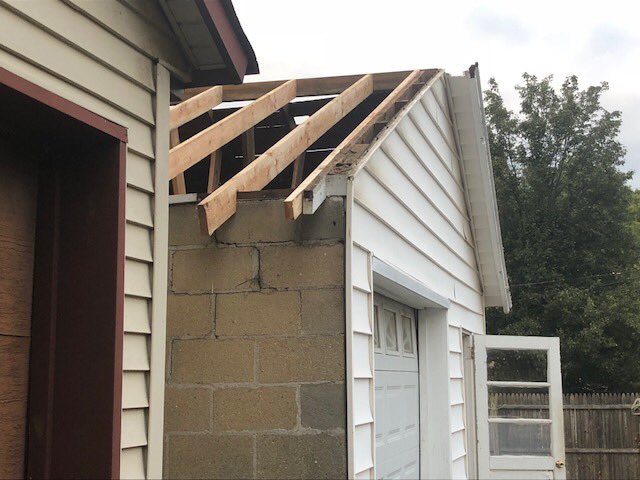 Rebuilding this badly rotted frame under the roof on this detached garage on John Street in Milltown. We provide the longest guarantee of any roofing company. #roofframe #roofsheathing #framing