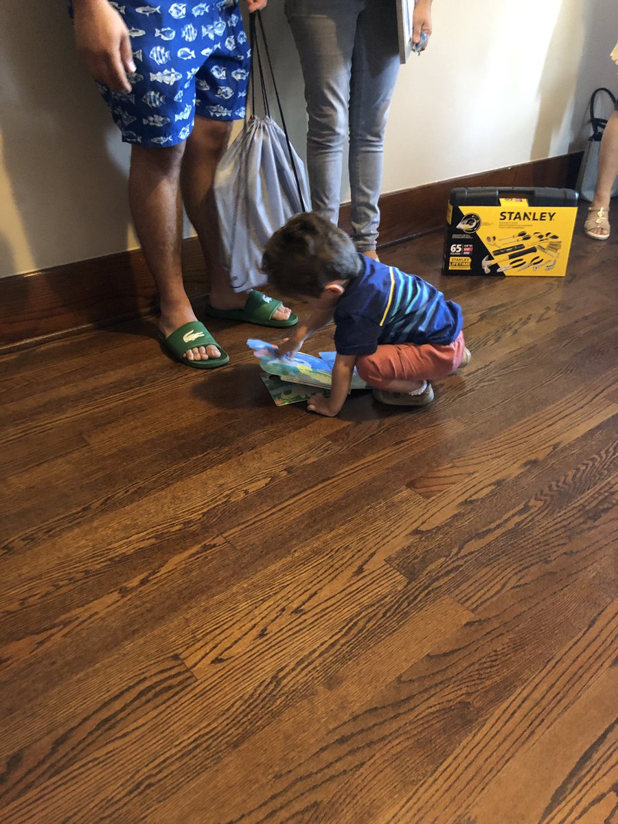 OmahaMRC's tweet photo. Andres cracking open his new books at @habitatomaha homecoming! https://t.co/F69smEXi6j