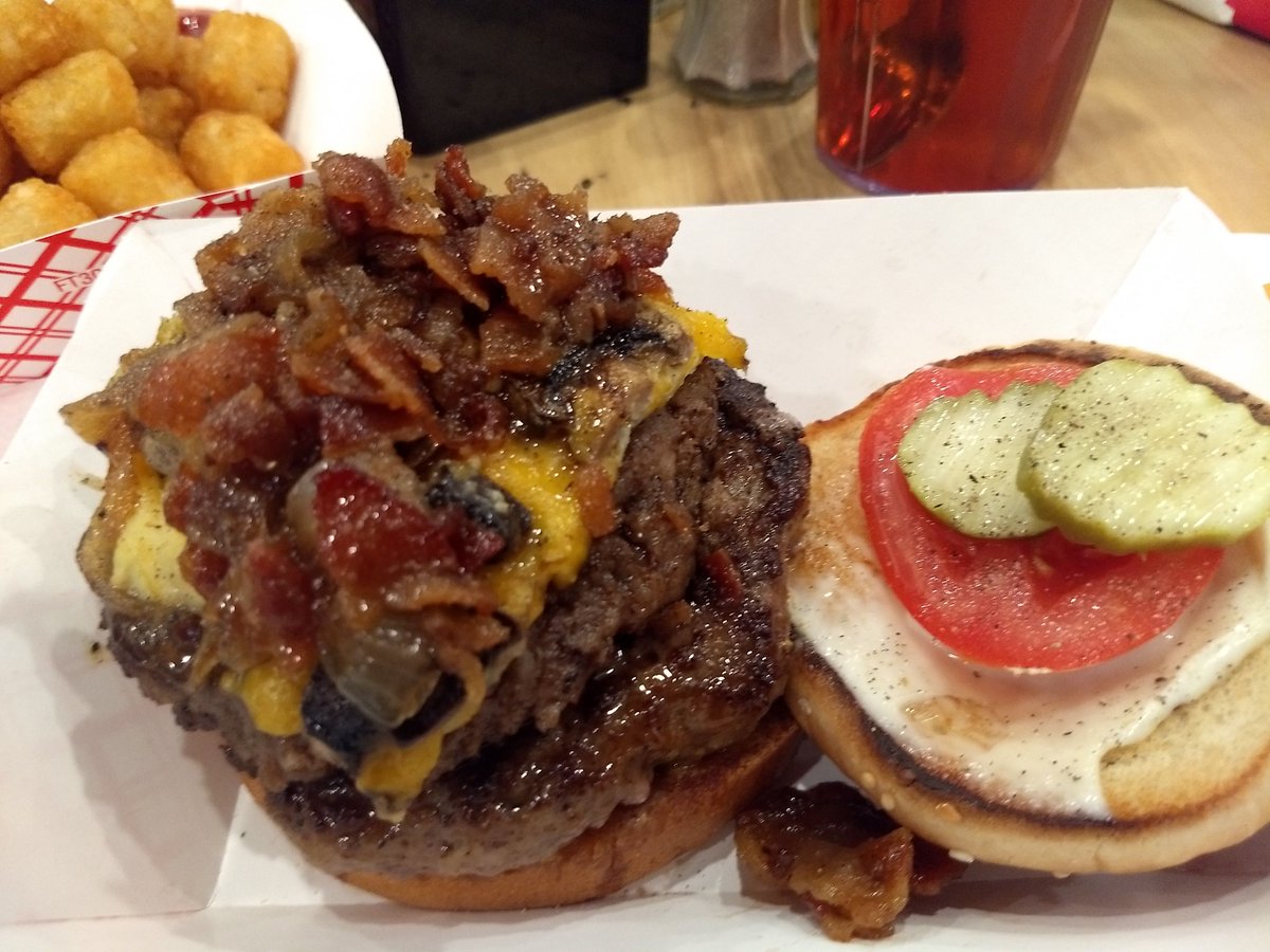 thesavvysmoker's tweet photo. The "Revival," as I recall, had a 3oz sausage patty over lettuce, with a beef patty, egg souffle, bacon jam, topped with the fixins! #famousmikes #maconburgerweek #madeinmacon #thesavvysmoker #downtownmacon #CheeseburgerDay https://t.co/1HMOwgalF2