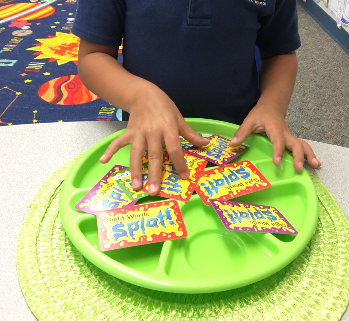 misskgrade1's tweet photo. First grade playing a rendition of “Splat” where they have to clear the the huge splat of their plates by flipping the card over and reading the sight word on the other side! https://t.co/MJMsvFQtBv