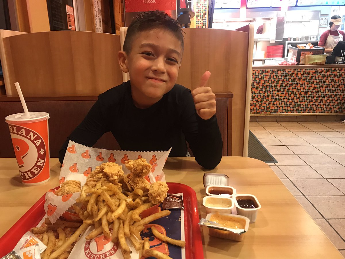 Post #hockey practice #fatherson meal @PopeyesChicken. We're trying out their #sauce offerings for their #bonelesswings. His favorite #blackenedranch. My favorite #sweetheat