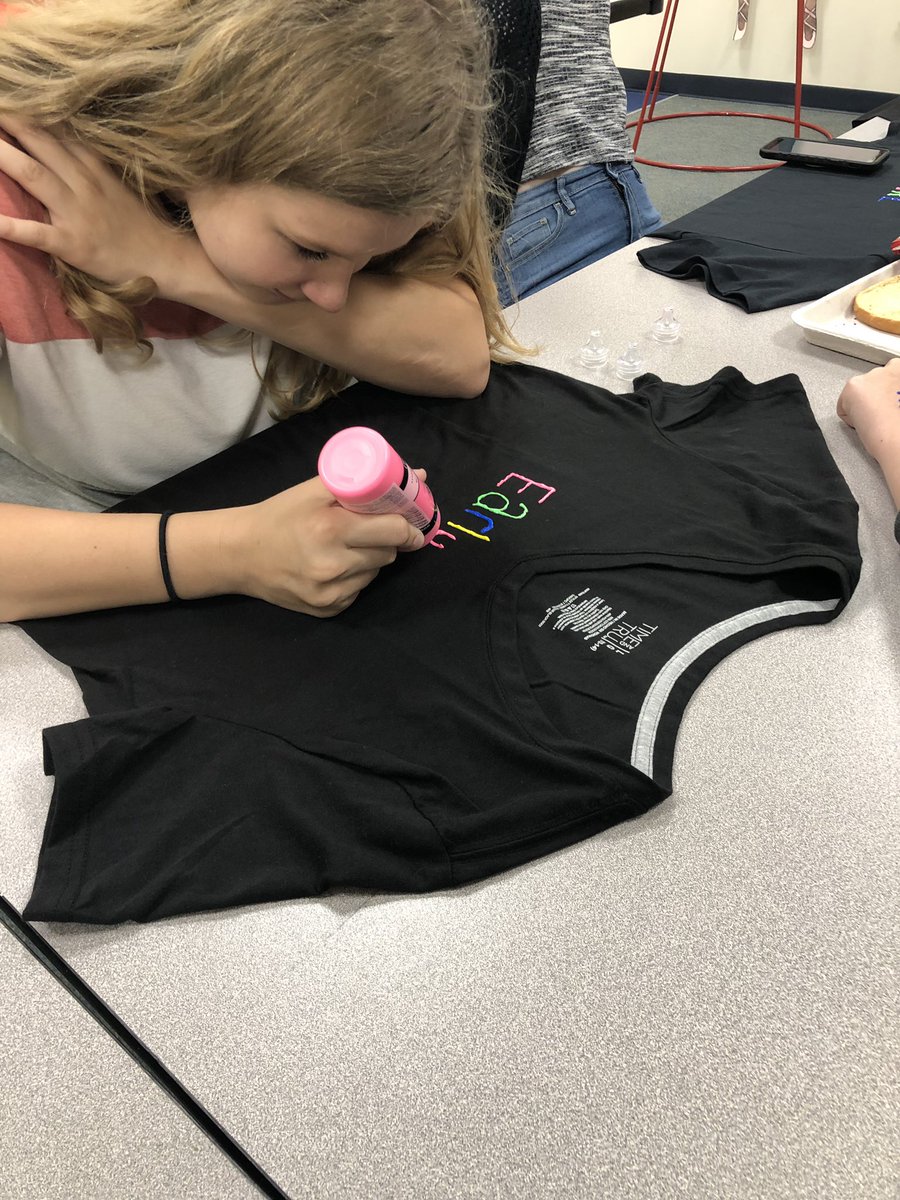 Early childhood students are prepping to ROCK our school tomorrow with our class shirts!