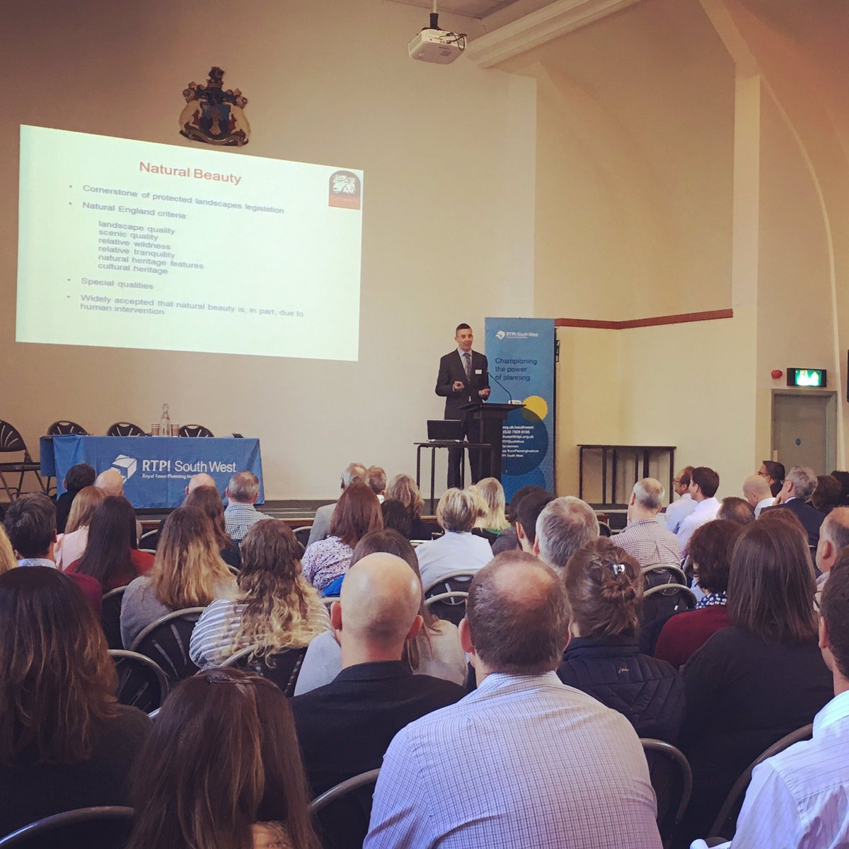 CotswoldsNL's tweet photo. Great to see John, our Planning Officer, talking to the @RTPISouthWest conference this morning about planning issues in the #cotswoldsaonb 
#RTPIcpd #conserveandenhance #protectedlandscapes https://t.co/2HBQT8CWXZ