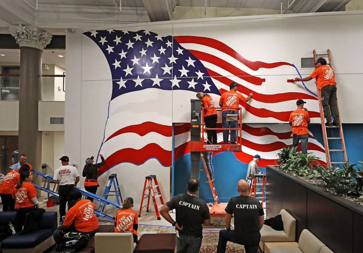 At the New England Center and Home for Veterans Boston, a home makeover including the painting of a large American flag mural in the lobby done by volunteers from The Home Depot Foundation Partners
