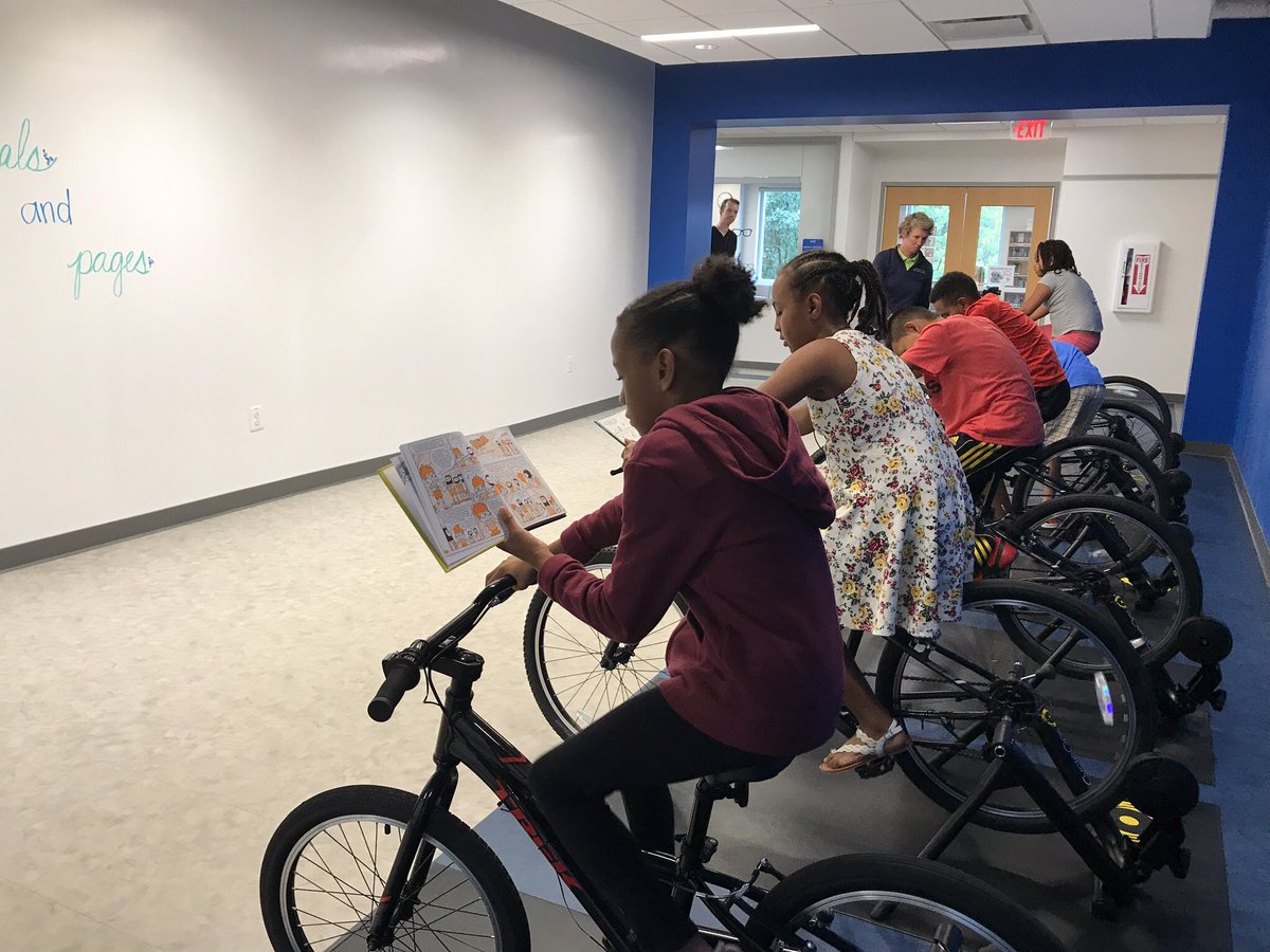 KellyeWJZ's tweet photo. While these 4th graders @FerdinandTDayES let their legs do the work on stationary bikes, the books they’re holding take their minds to far away places. “You’re riding but you’re also reading &amp; it’s training your muscles &amp; your brain," said Ava Walker. Watch tonight @ 5. @ACPSk12 https://t.co/4ShSv4N3nA
