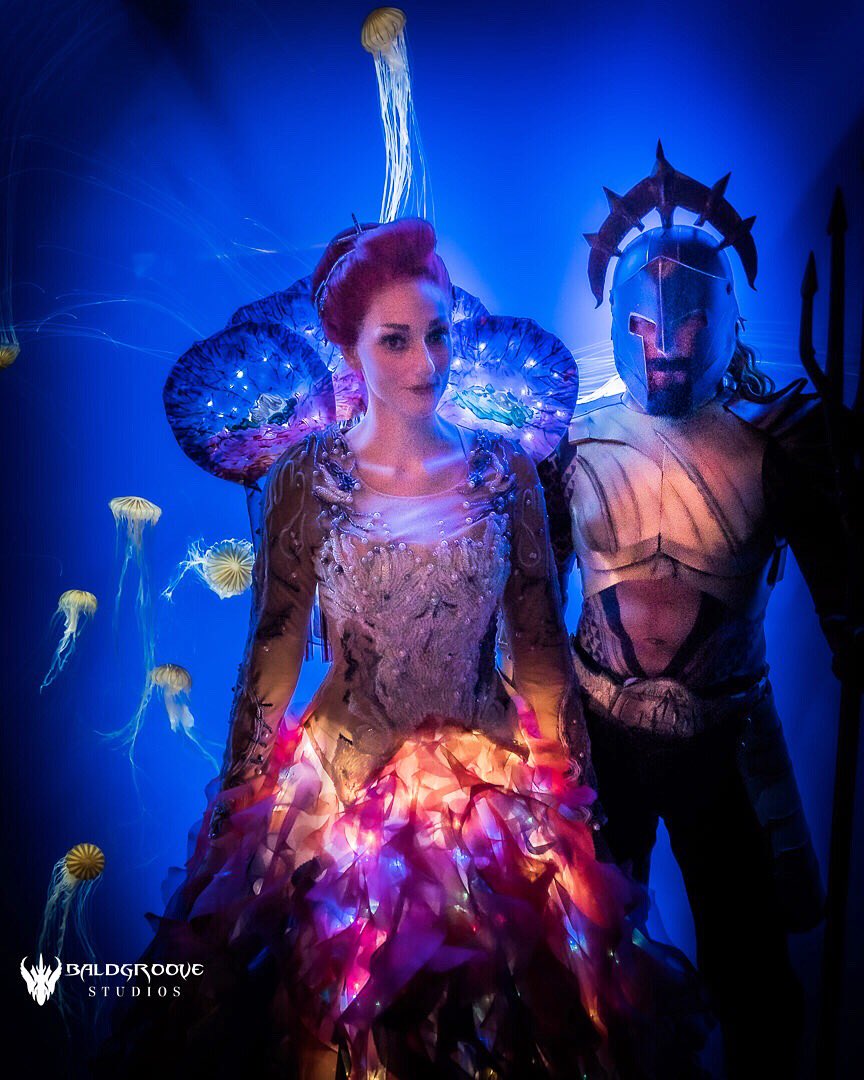JColtonCosplay's tweet photo. “The plan WAS to get the Trident first, then challenge Orm!” 📷 @Baldgroove  
My costume is made by mom &amp; I. Tried to get it close to what Kym Barrett designed &amp; what @realamberheard wore. Gladiator Arthur is @RevengeCityCos 
#aquamancosplayer #meracosplayer #jellyfishdress https://t.co/IRvs4f8gIE