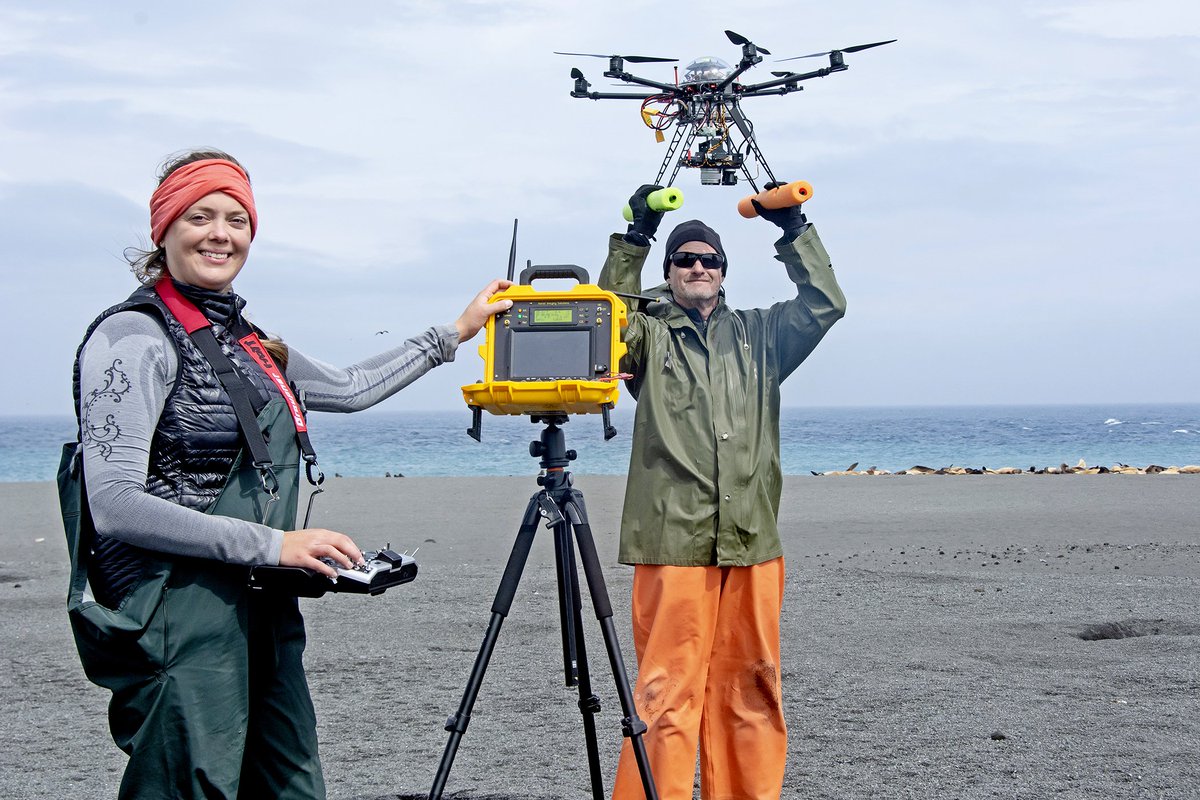 Katie Sweeney and Brian Fadely work with unmanned aerial system on Bogoslof Island.
