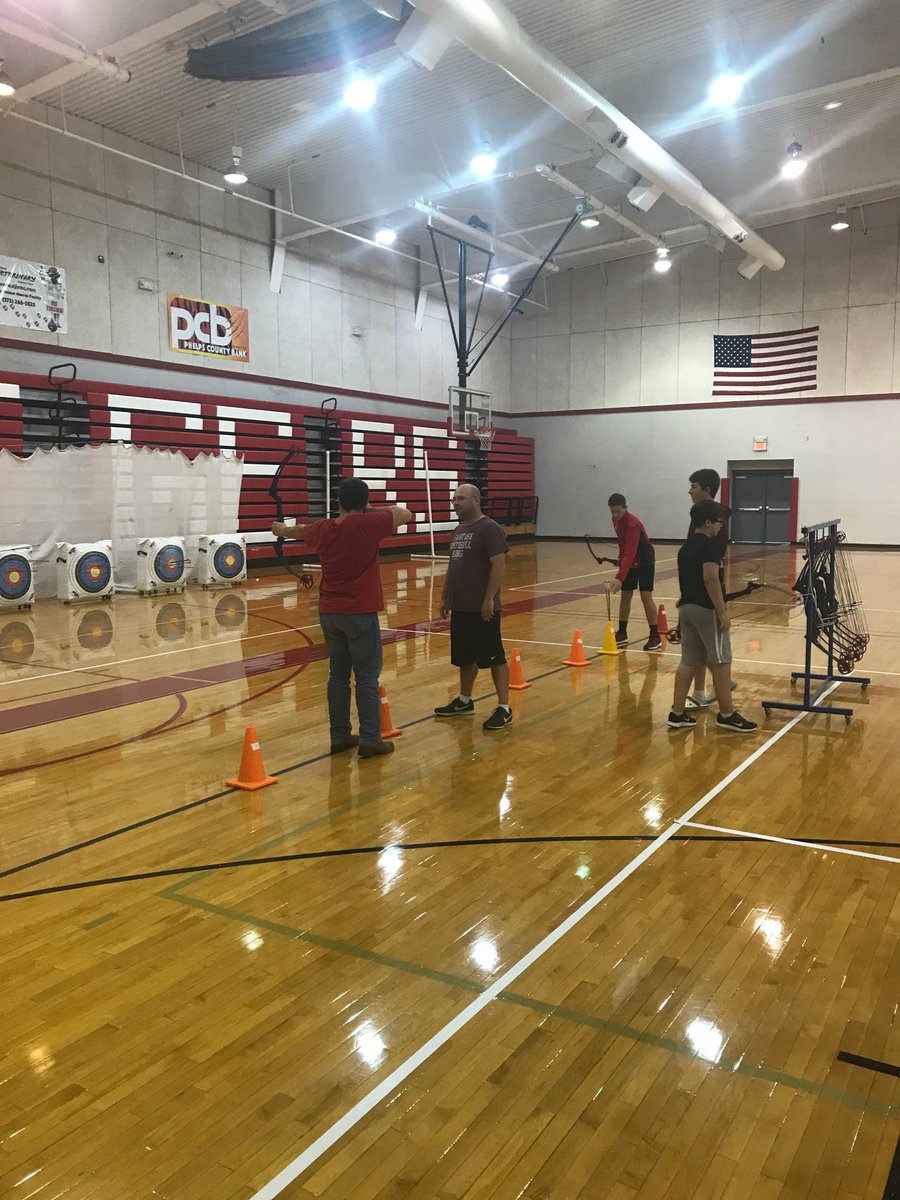 STJSchools's tweet photo. Middle School students sharpening their target practice skills during their Archery Unit. #stjtigerpride #learning #MoNASP https://t.co/5n8rOK33El