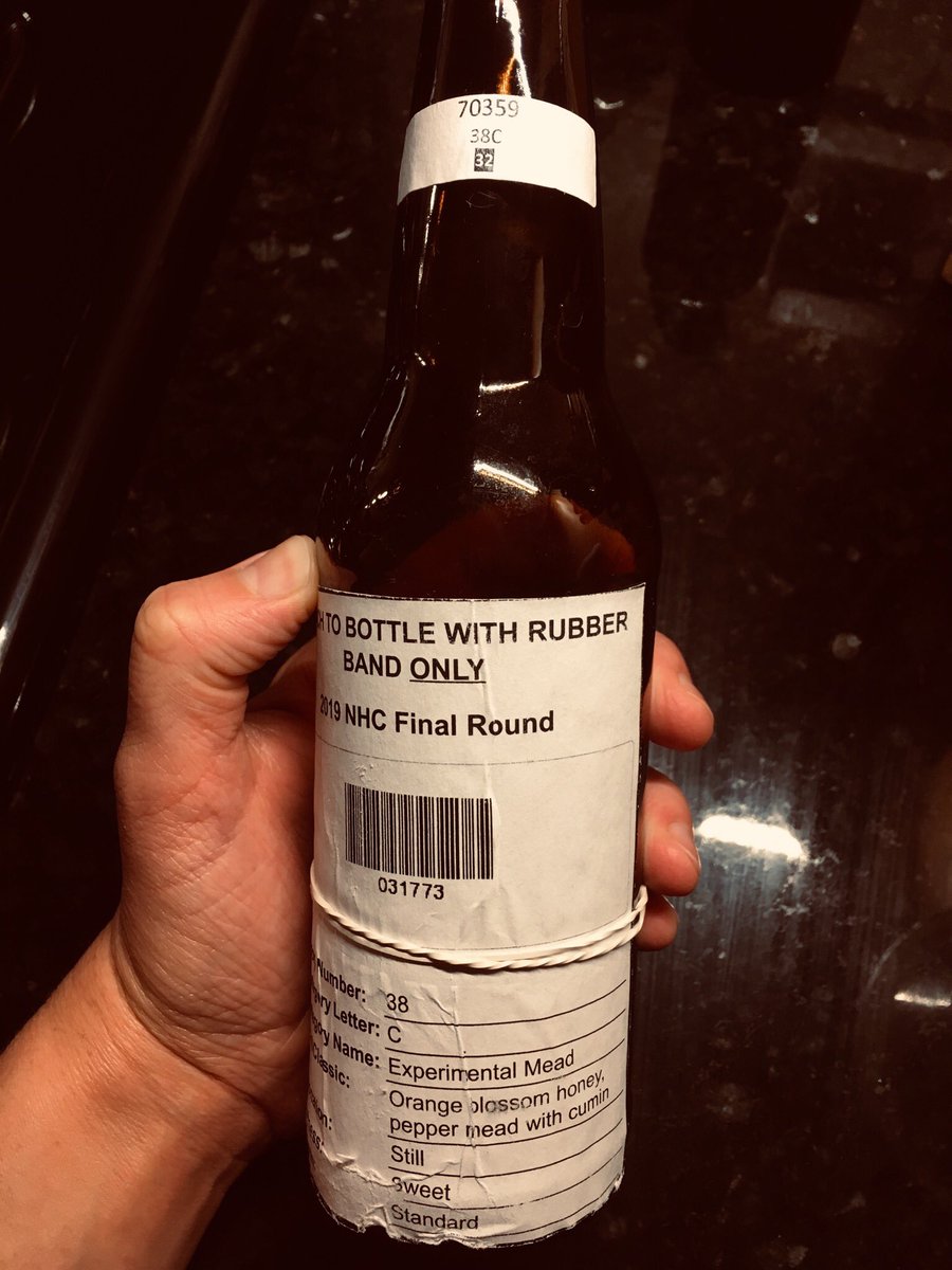 theresamccu's tweet photo. This feels like a missed connections post: I picked up this bottle at #Homebrewcon,  finally opened it tonight. Experimental mead w orange blossom honey, pepper, and cumin. So unexpected and SO good. Mystery homebrewer, who are you? @HomebrewAssoc #beerhistory https://t.co/E4qMfmPcPu