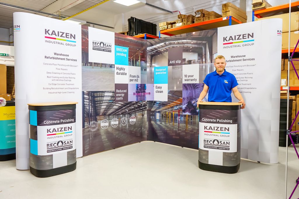 You know it’s going to be a busy day when you walk in and see several linked pop up stands already up and test built! No one loves a challenge more than our production team, though. This stand for <a href="/kaizencleaning/">Kaizen Group</a> is now ready to be shipped. Onto the next!