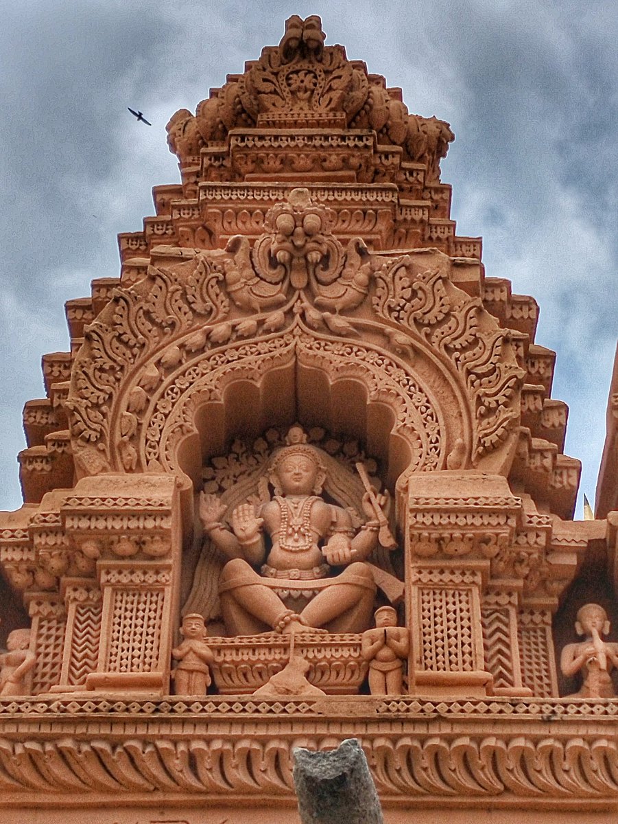 82) Dakshinamurthy. He holds Veena with upper left hand, with front right hand in Abhsyamudra. Here he is sitting in Utkutikaasana posture. He is sitting under the Vata vriksha (Banyan tree).