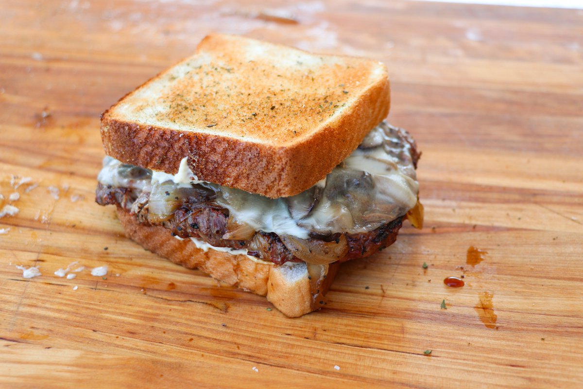 HowToBBQRight's tweet photo. Bonafide Ribeye Sandwich - kept the ribeye whole and topped it with onions, mushrooms, provolone cheese and a garlic mayo... might be the best sandwich I've ever had... https://t.co/u6F0lMYE7E https://t.co/xNdKFpJ1iM