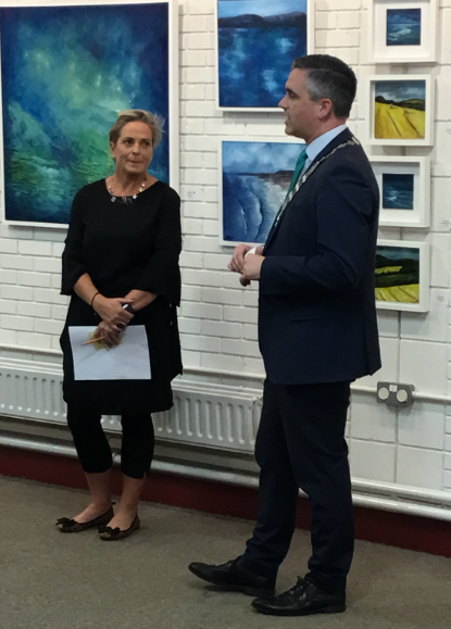 TippLib's tweet photo. We are delighted to have Marie-Claire Keague exhibiting with us again in Clonmel Library. There was a wonderful launch of her new exhibition 'This Place' opened by Cllr Garret Ahearn, Mayor of Clonmel. Some wonderful artwork by Marie-Claire on display until Saturday week. https://t.co/jEha7QFfyX