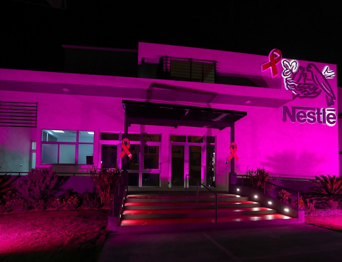 JamaicaGleaner's tweet photo. In honour of #BreastCancerAwarenessMonth, Nestle Jamaica Limited lights its head office in pink on October 1 to show solidarity in the fight against cancer. The company will donate part proceeds from sales to the Jamaica Cancer Society to aid in the fight against cancer. https://t.co/z5p1zXLyZM